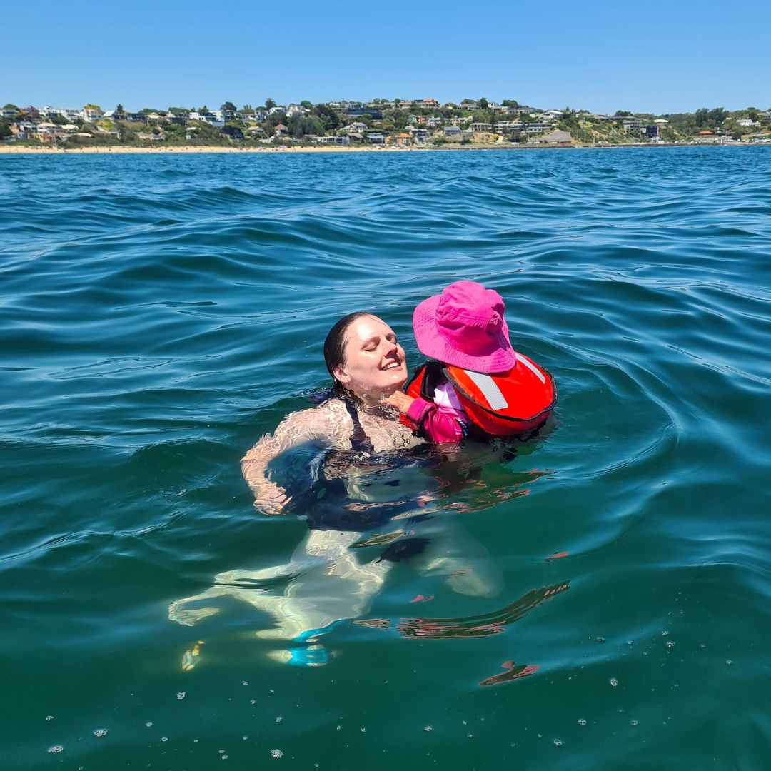 Molly swimming with a child
